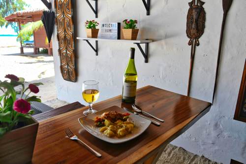 Baked prawn with Mozarella cheese and potatoes meal served at Cove Eco Resort restaurant, Yeben Island, Raja Ampat