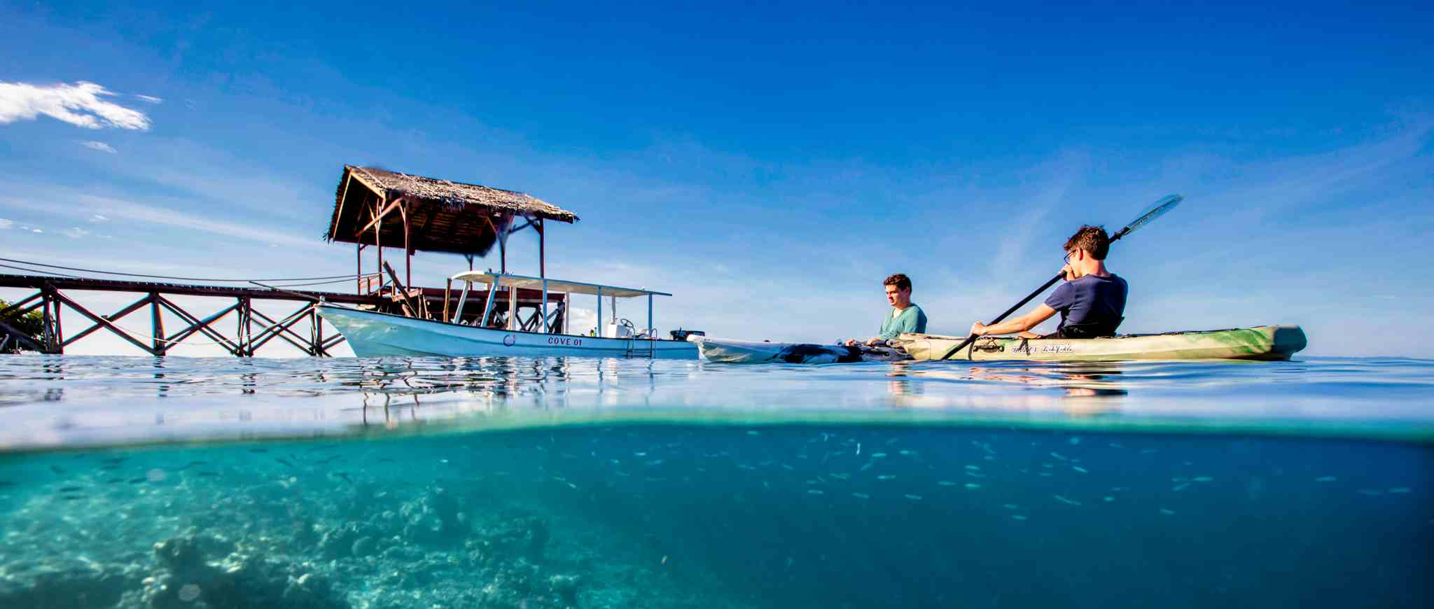 Cove jetty with bottom glass kayak, Yeben Island, Raja Ampat