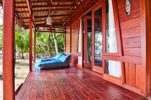 Blue sofa to relax under the porch of Cove Eco Resort Villa from side view, Yeben Island, Raja Ampat